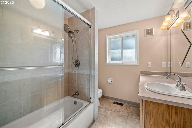 bathroom with toilet, baseboards, visible vents, and vanity