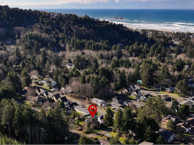 bird's eye view with a water view and a view of the beach