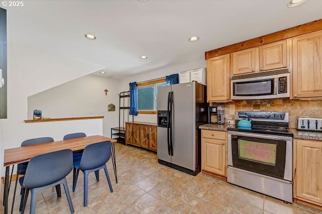 kitchen with light stone counters, appliances with stainless steel finishes, light brown cabinets, and backsplash