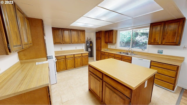 kitchen with a center island, dishwasher, electric water heater, and sink