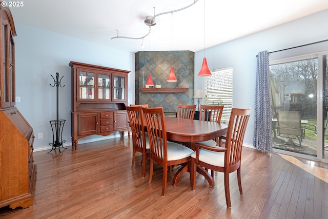 dining room with light wood-style floors and baseboards