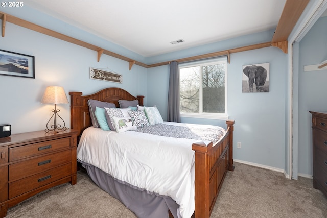 bedroom with light colored carpet, visible vents, and baseboards