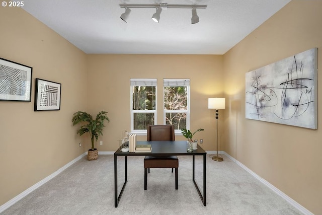 office space with light colored carpet and baseboards