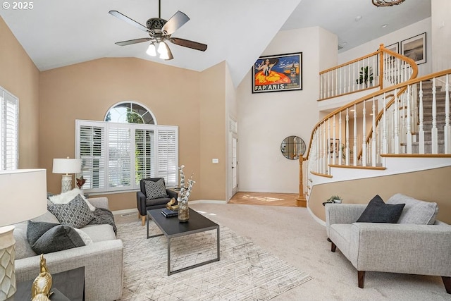 living area featuring high vaulted ceiling, carpet, a healthy amount of sunlight, and stairs