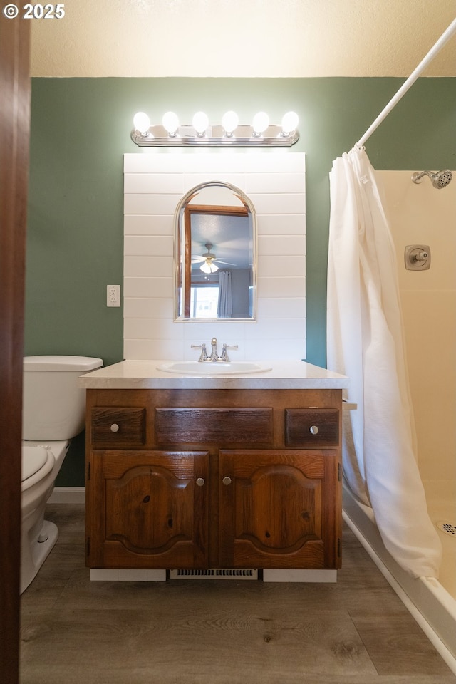 bathroom with vanity, toilet, and a shower with shower curtain