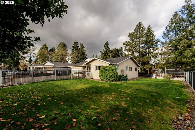 rear view of house featuring a lawn