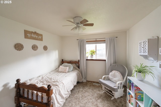 bedroom featuring light carpet and ceiling fan