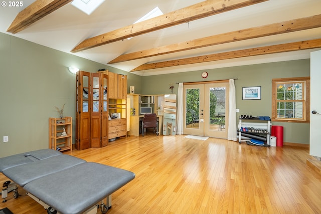 1034 Lawrence St, Eugene, OR 97401 - living area featuring french doors, light wood-style flooring, and a skylight