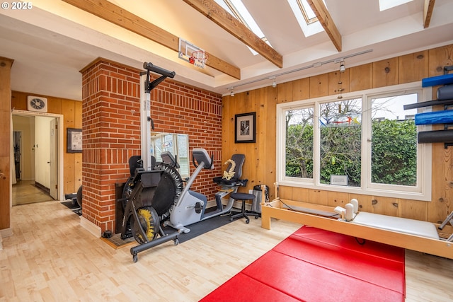 1034 Lawrence St, Eugene, OR 97401 - exercise room featuring wood finished floors, wood walls, and a skylight