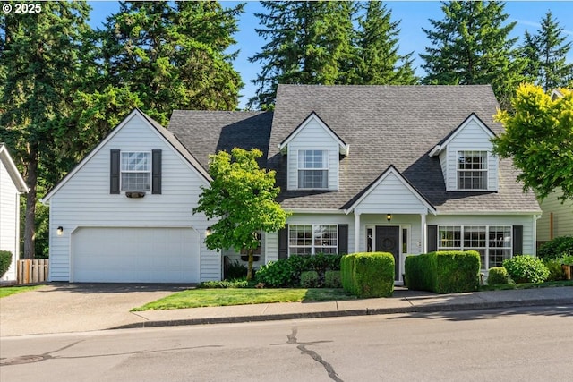 14940 SW Michael Ct, Sherwood, OR 97140 - new england style home with a garage, driveway, and roof with shingles