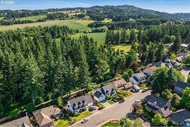 14940 SW Michael Ct, Sherwood, OR 97140 - aerial overview of property's location with nearby suburban area and a heavily wooded area