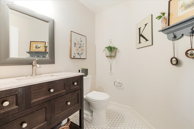 14940 SW Michael Ct, Sherwood, OR 97140 - half bathroom with toilet, vanity, tile patterned floors, and baseboards