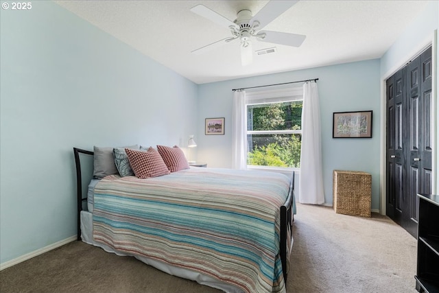 14940 SW Michael Ct, Sherwood, OR 97140 - carpeted bedroom featuring a closet, a ceiling fan, and baseboards
