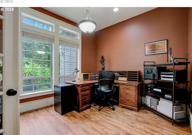 office featuring light wood-style flooring and baseboards