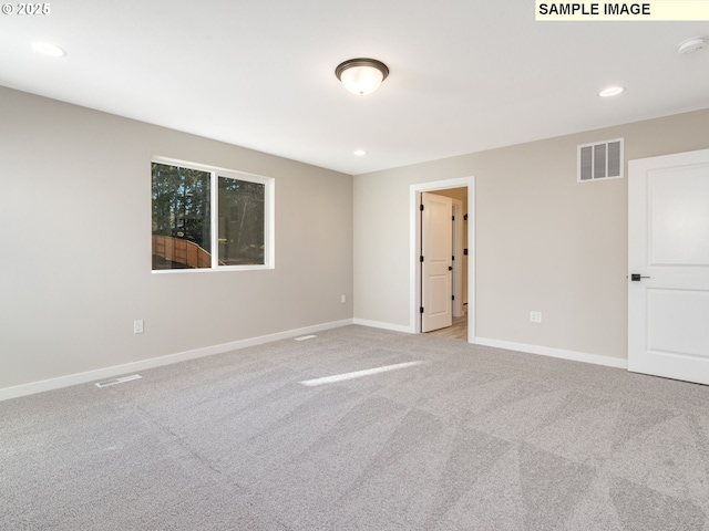 unfurnished room featuring recessed lighting, visible vents, carpet floors, and baseboards