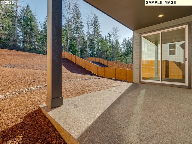 view of yard with a patio and fence