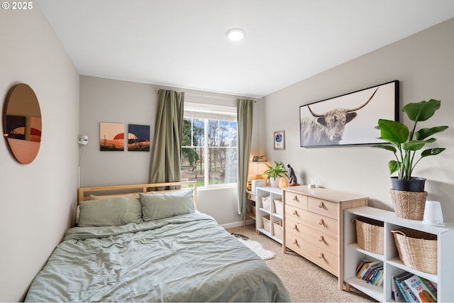 bedroom featuring light colored carpet