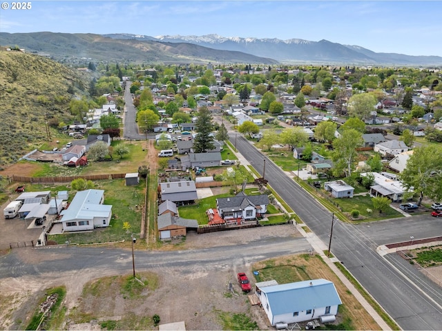 aerial view of residential area featuring mountains