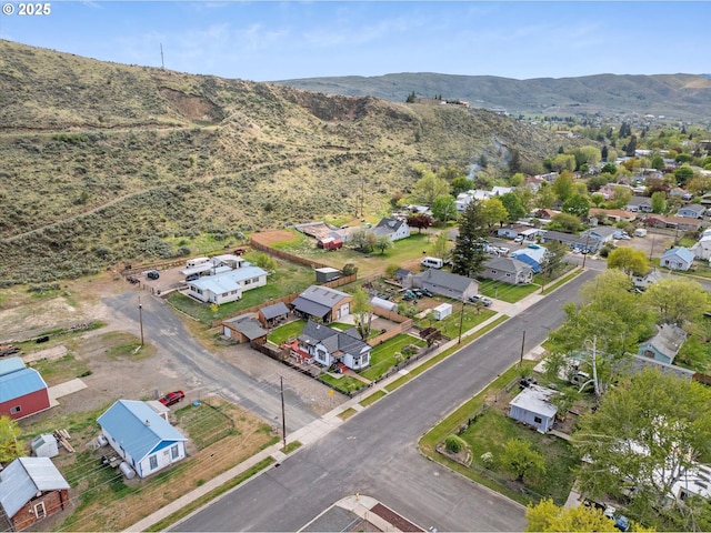 aerial view of residential area with mountains