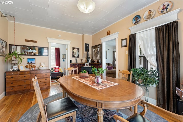 dining space featuring plenty of natural light and hardwood / wood-style floors