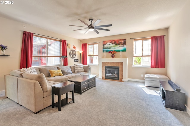 12130 SW Kelly Ln, Tigard, OR 97223 - living area with a ceiling fan, light colored carpet, a fireplace, and baseboards