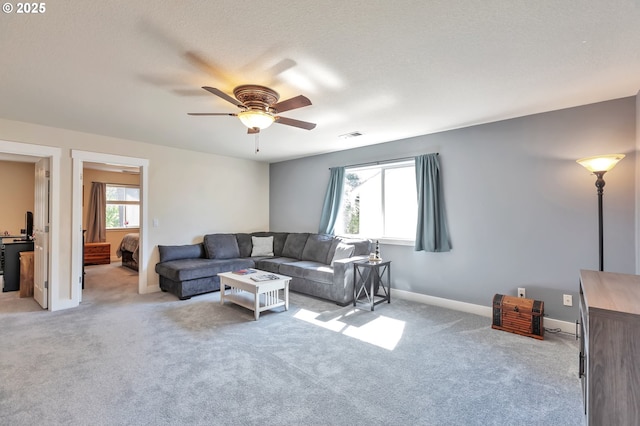 12130 SW Kelly Ln, Tigard, OR 97223 - living area with ceiling fan, light colored carpet, and baseboards