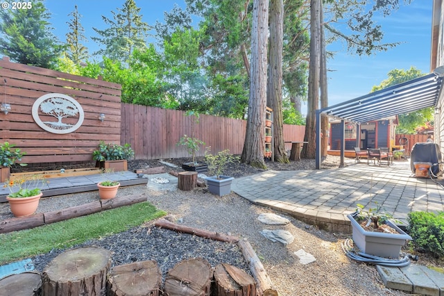 12130 SW Kelly Ln, Tigard, OR 97223 - fenced backyard featuring a patio and area for grilling