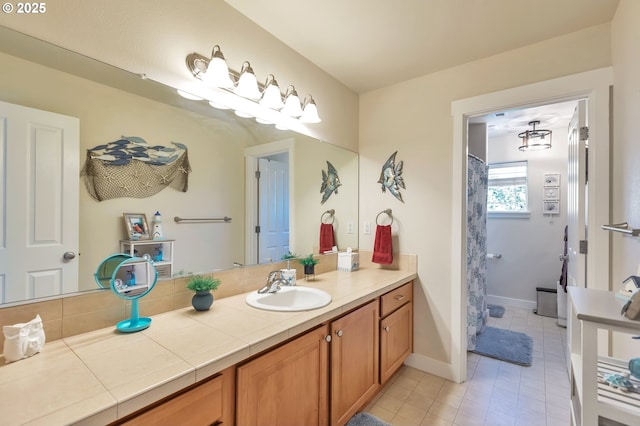 12130 SW Kelly Ln, Tigard, OR 97223 - bathroom with vanity, tile patterned flooring, and baseboards