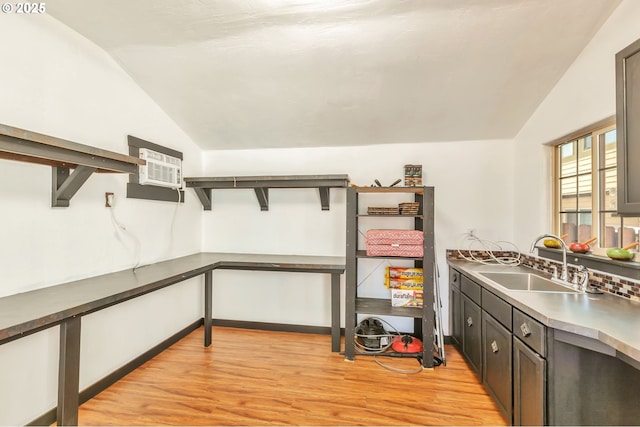 12130 SW Kelly Ln, Tigard, OR 97223 - kitchen featuring lofted ceiling, a sink, light wood-type flooring, and a wall mounted AC