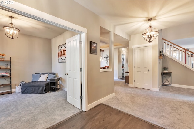 12130 SW Kelly Ln, Tigard, OR 97223 - carpeted foyer with a chandelier, baseboards, stairs, and wood finished floors