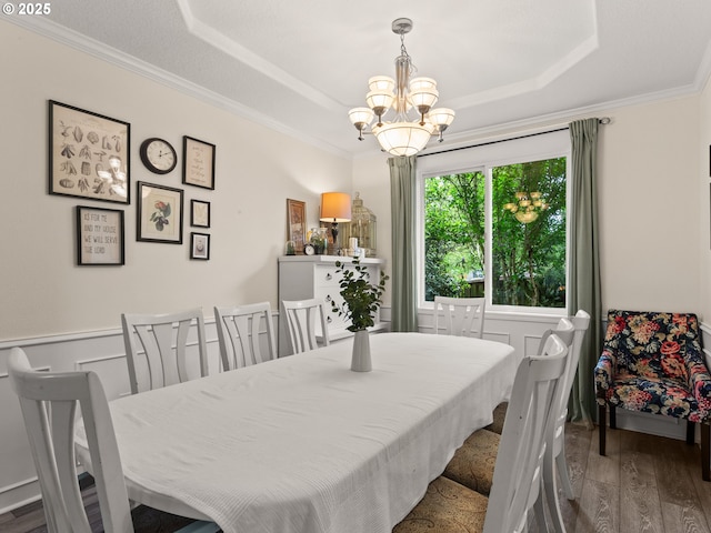 17717 NE 26th St, Vancouver, WA 98684 - dining space featuring a chandelier, wood finished floors, a raised ceiling, crown molding, and wainscoting