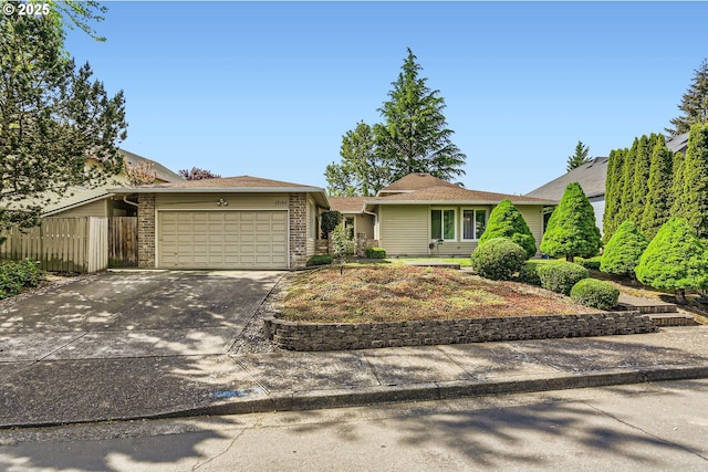 17180 NW Joscelyn St, Beaverton, OR 97006 - view of front of property featuring an attached garage, fence, driveway, and brick siding