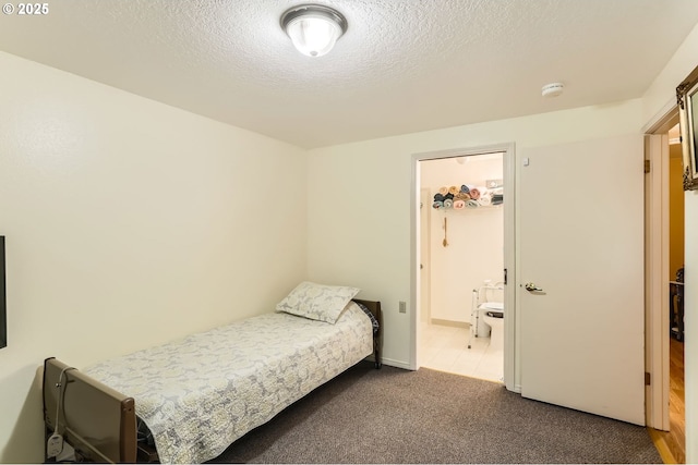 17180 NW Joscelyn St, Beaverton, OR 97006 - carpeted bedroom with a textured ceiling and ensuite bath