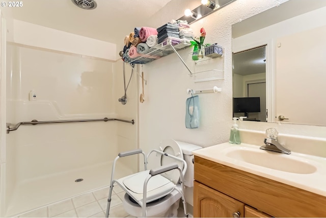 17180 NW Joscelyn St, Beaverton, OR 97006 - full bath with a shower stall, toilet, tile patterned flooring, and vanity