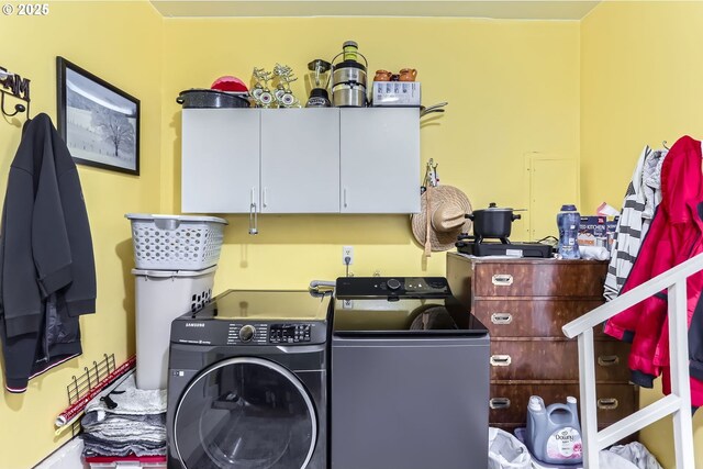 17180 NW Joscelyn St, Beaverton, OR 97006 - washroom featuring cabinet space and washing machine and clothes dryer