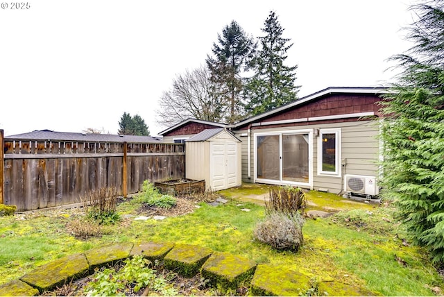 view of yard featuring ac unit and a storage shed