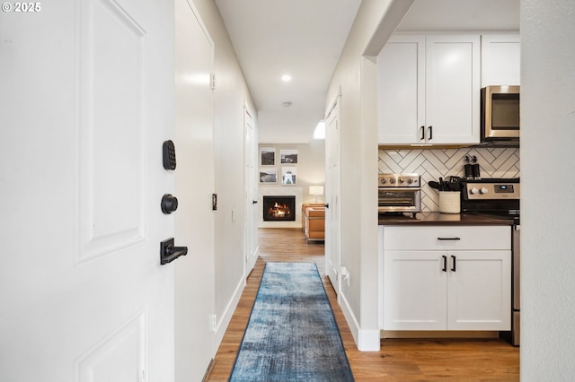 1630 NW Eastbrook Ct, Beaverton, OR 97006 - hall featuring light wood-type flooring and recessed lighting