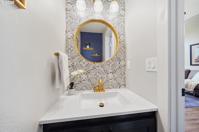 1630 NW Eastbrook Ct, Beaverton, OR 97006 - ensuite bathroom featuring vanity and wood finished floors