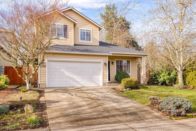 view of front of home featuring a garage and a front yard