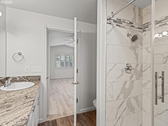 14108 NE 94th St, Vancouver, WA 98682 - full bath with lofted ceiling, a marble finish shower, vanity, and wood finished floors