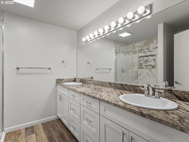 14108 NE 94th St, Vancouver, WA 98682 - full bath with a stall shower, double vanity, and wood finished floors