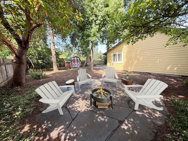 14108 NE 94th St, Vancouver, WA 98682 - fenced backyard with an outdoor fire pit, a storage unit, and a patio area