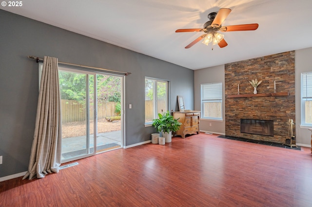 17474 SW Sarala St, Beaverton, OR 97007 - unfurnished living room with wood finished floors, a ceiling fan, a fireplace, and baseboards