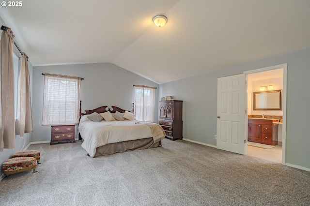 17474 SW Sarala St, Beaverton, OR 97007 - bedroom featuring light carpet, lofted ceiling, ensuite bathroom, baseboards, and a sink