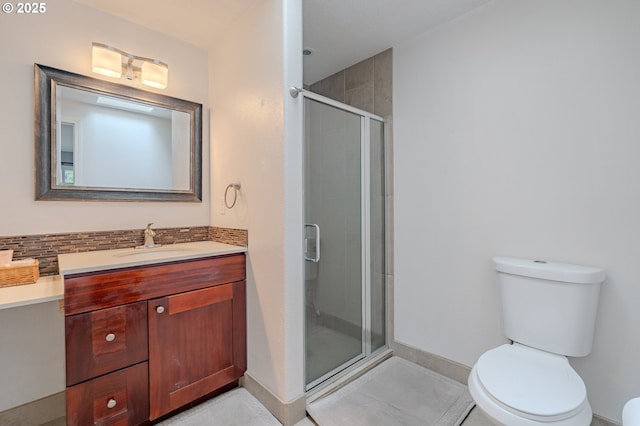 17474 SW Sarala St, Beaverton, OR 97007 - full bathroom with a stall shower, toilet, vanity, baseboards, and tile patterned flooring