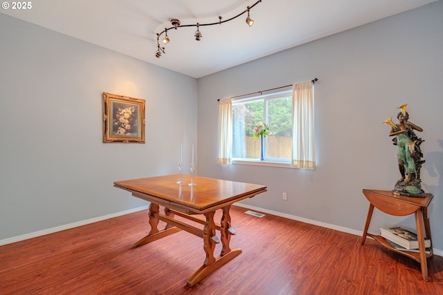 17474 SW Sarala St, Beaverton, OR 97007 - dining space featuring wood finished floors, baseboards, and track lighting