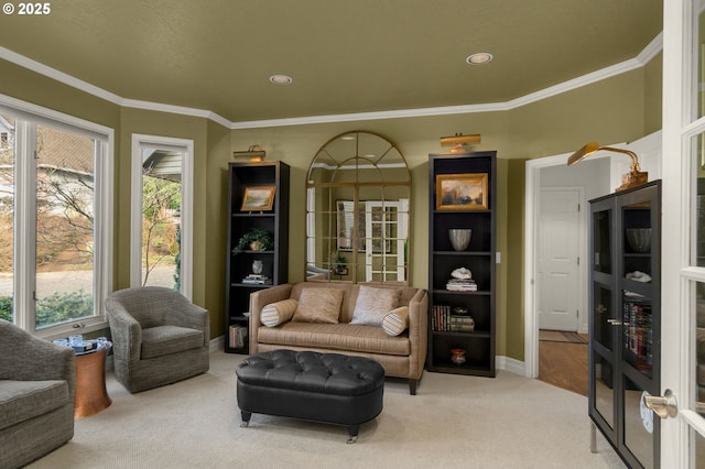 living area featuring recessed lighting, baseboards, carpet flooring, and crown molding