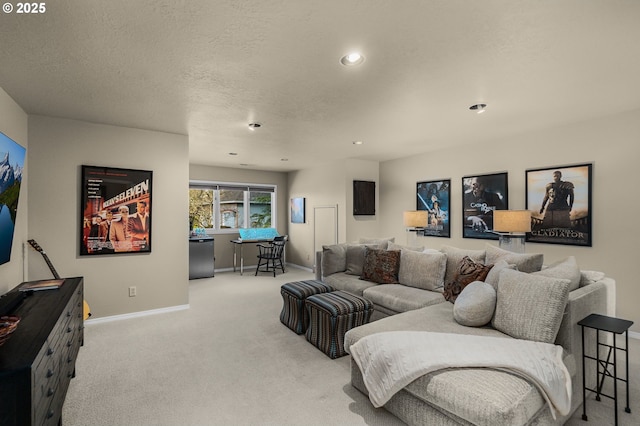 living area with baseboards, recessed lighting, a textured ceiling, and carpet