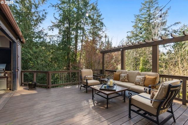 wooden terrace with outdoor lounge area