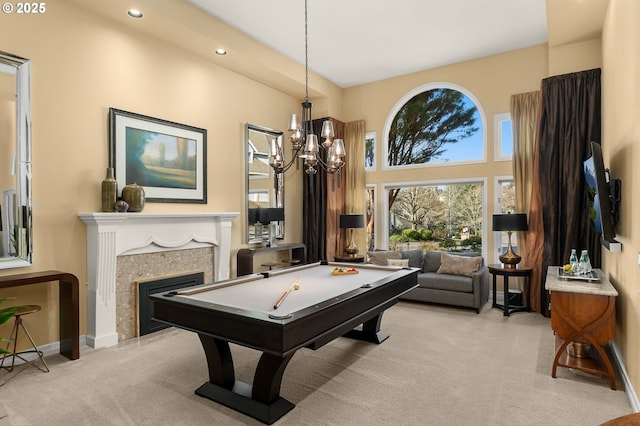 rec room featuring baseboards, recessed lighting, a fireplace, pool table, and light carpet